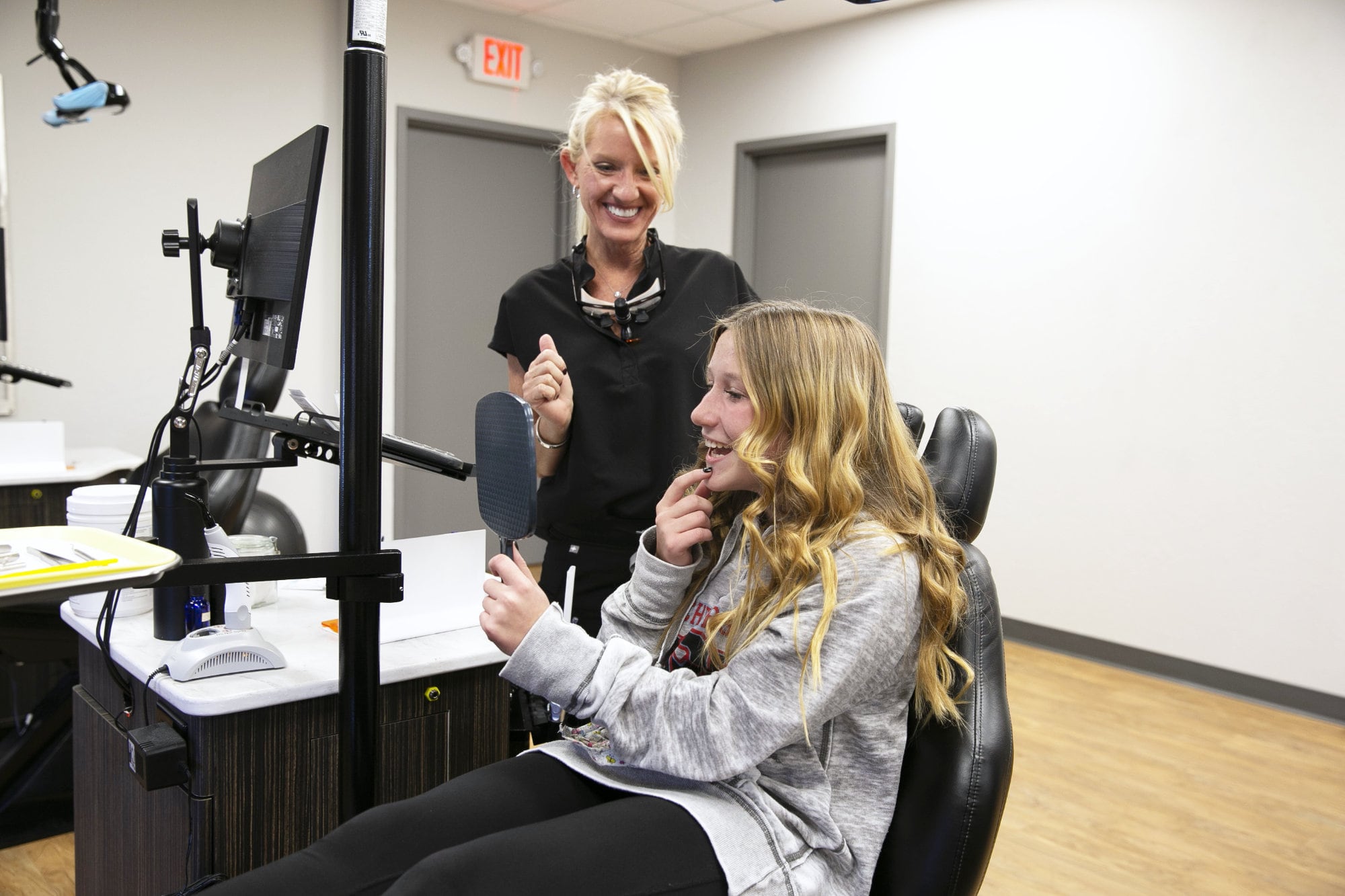 orthodontic patient smiling with braces